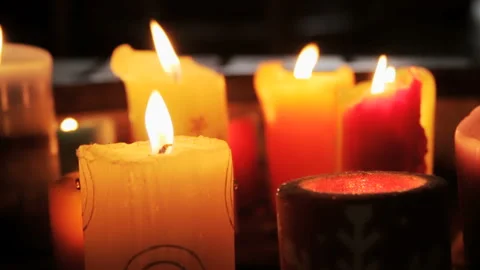 Group of Burning Decorative Pillar Candles with Warm Bokeh Stock Footage 335884114