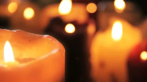Group of Burning Decorative Pillar Candles with Warm Bokeh Stock Footage 343425925