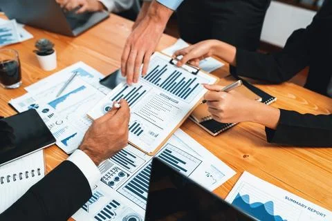 Group of business analyst team analyzing financial data report. Habiliment Stock Photos