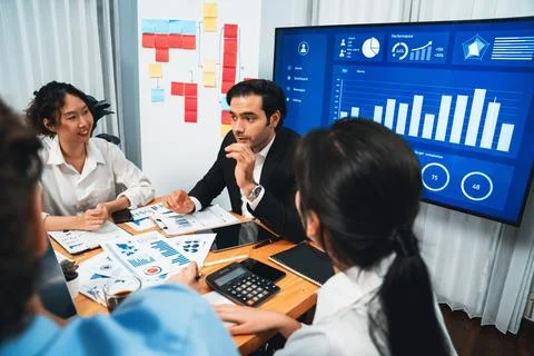 Group of business analyst team analyzing financial data report. Habiliment Stock Photos