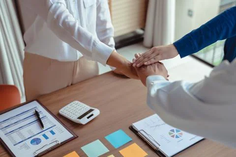 Group of business colleague stack hands together while discussing and cowor.. Stock Photos
