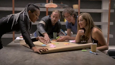 A group of business millennials working together in a co-working space Stock Footage