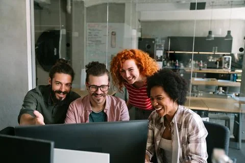 Group of business people and software developers working as a team in office Stock Photos