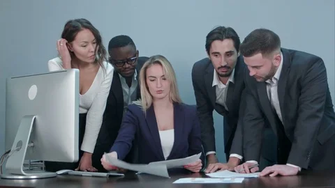 Group of business people busy discussing financial matter during meeting Stock Footage