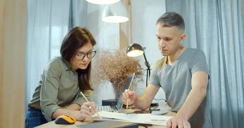 Group of business people checking the project plan on paper discussing new ideas Stock Footage 132245590