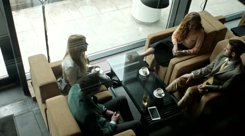 Group of business people having a chat at a cafe. Stock Footage 61158020