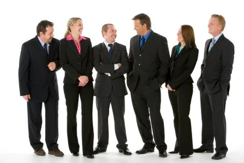 Group Of Business People Standing Around Conversing Stock Photos