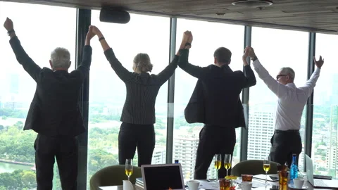 Group of Business people teamwork join hands and arms raised together to cele Stock Footage 158535278