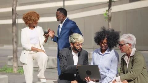 Group of business people working using laptop outdoors Stock Footage 262955234