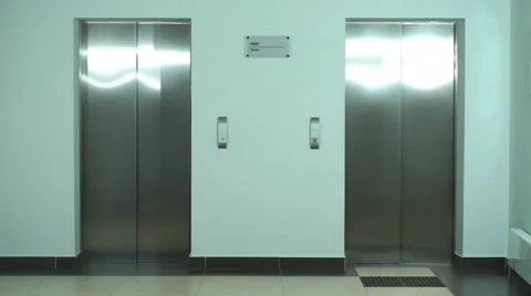 A group of businessmen coming out of the Elevator Stock Footage 67496003