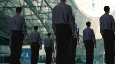 Group of businessmen, on of them turns to camera. Stock Footage 43633077