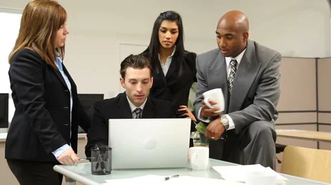 Group of businesspeople look at computer Video stock 61667976