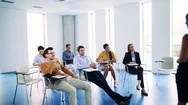 A Group Of Businesspeople Sitting In A Board Room, Brainstorming. Stock Footage