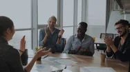 Group Of Businesspersons Cheering And Clapping For A Co-Worker At The Office Stock Footage
