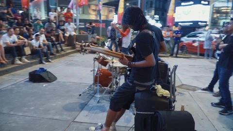 A group of buskers performing at Bukit Bintang street in public place Stock Footage 105722810