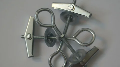 Group of butterfly plugs specific for plasterboard walls. Rotating view dowel Stock-Footage 120530204
