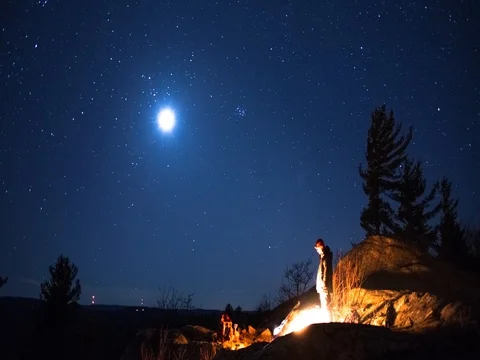 Group at Campfire while Moonsets Stock Footage 80146154