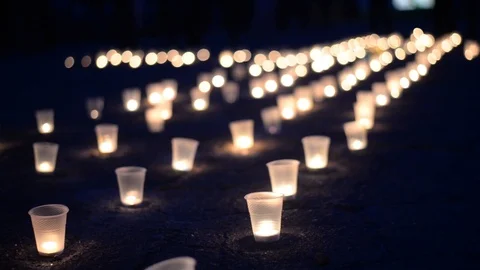 A group of candles burning in street. Day of Remembrance for the Bereaved Stock Footage