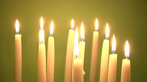 Group of candles on green background Stock Footage 32052798