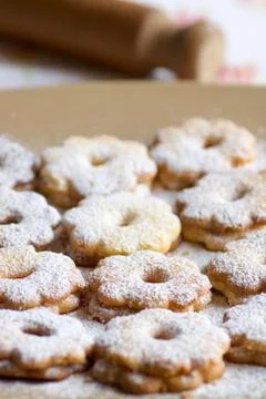 Group of canestrelli biscuits covered of icing sugar on a plate Stock Photos