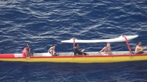 A group of canoeists on a break near Easter Island Stock Footage 162813573