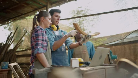 Group carpenter talking together for design woodcraft furniture at wood workshop Video stock 263111820