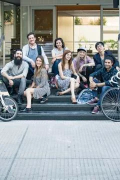 Group of casual professionals sitting on steps Stock Photos
