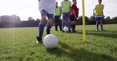 Group of Caucasian boys practising before their football match. Stock Footage 56823095