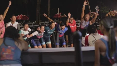 Group celebration after an exciting competition at the beach in the evening 스톡 동영상 307731395