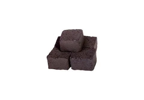 Group of charcoal cubes isolated on white background Foto stock