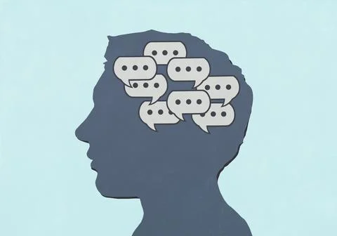 Group of chat bubbles inside silhouetted man's head against blue background Stock Illustration