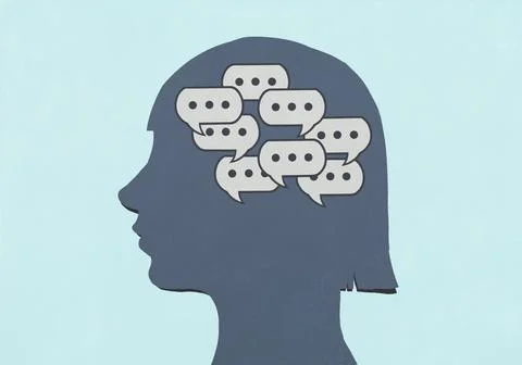 Group of chat bubbles inside silhouetted girl's head against blue background Stock Illustration