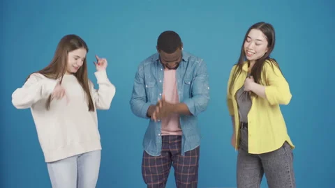 Group of cheerful and funny multiethnic friends having fun together, dancing. Stock Footage 228810046