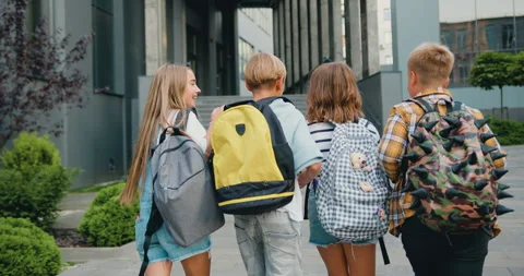 Group of cheerful energetic students child girl boy go to modern campus school Stock Footage 248615731