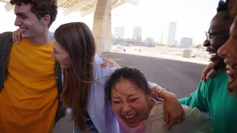 Group of cheerful multi-ethnic generation z people laughing and hugging together Stock Footage 273092377
