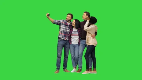 A group of cheerful students taking a selfie on a Green Screen, Chroma Key. Stock Footage
