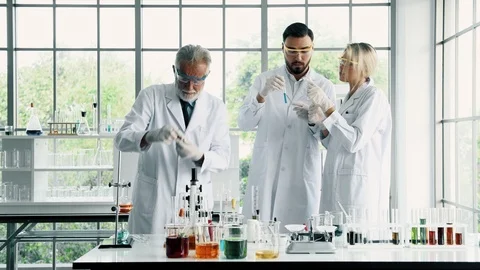 Group of chemist working in a lab, discussing work. Stock Footage 99014810