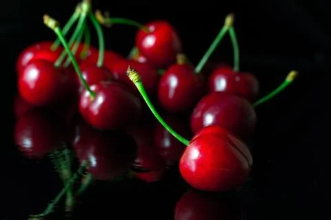 Group of cherries with reflection Stock Photos