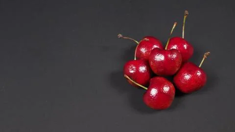 Group of cherry on black background. Stock Photos