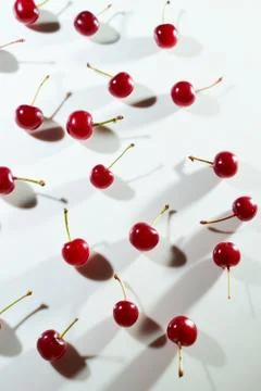 Group of cherry on a white background with shadows. Close-up. Top view. Stock Photos