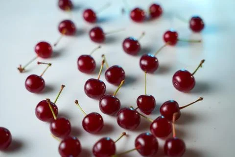 Group of cherry on a white background with shadows. Close-up. Top view. Stock Photos
