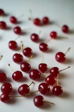 Group of cherry on a white background with shadows. Close-up. Top view. Stock Photos