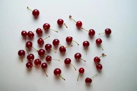 Group of cherry on a white background with shadows. Close-up. Top view. Stock Photos