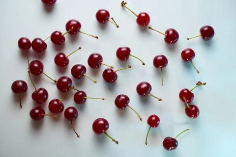 Group of cherry on a white background with shadows. Close-up. Top view. Stock Photos