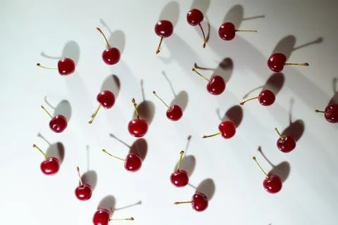 Group of cherry on a white background with shadows. Close-up. Top view. Stock Photos