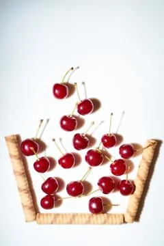 Group of cherry on a white background with shadows. Fall in the improvised Stock Photos