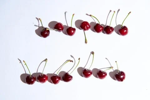 Group of cherry on a white background with shadows. Close-up. Top view. Stock Photos