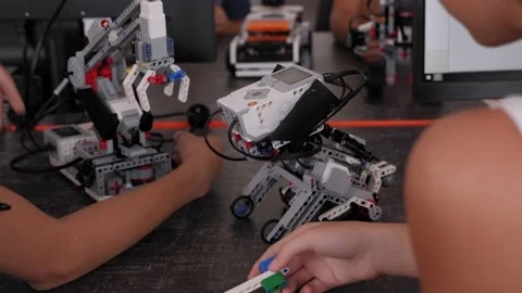 Group of children are making robots from the constructor in School of Robotics. Stock Footage 142010448