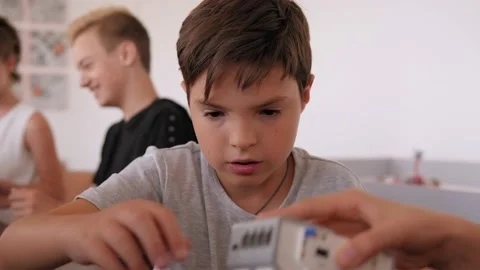 Group of children are making robots from the constructor in School of Robotics. Stock Footage 142010991