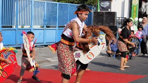 Group of children are performing the Jaran Kepang Stock Footage 281770321